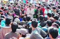 SDM Ajay Arora talks to the protestors at Clock Tower in Dehradun on Thursday.
