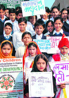 Students of Greenland Public School hold a rally during communal unity week in a village in Karnal on Thursday.
