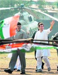 AICC general secretary Rahul Gandhi waves at supporters on his arrival during an election campaign for assembly elections at Harda in Bhopal