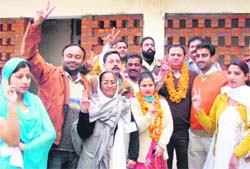 Anil Vij and Soma Devi, president and vice-president of the Pathankot Municipal Council, respectively, with their  supporters