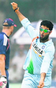 Yuvraj Singh celebrates the dismissal of Ravi Bopara during the third one-day international in Kanpur