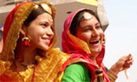 College students share a laugh at the Virasat Mela that began in Bathinda