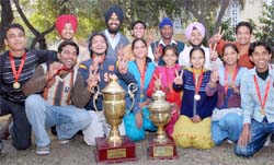Jubilant students of the Government Rajindra College with their trophies