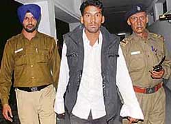 Pardeep in police custody at the Sector 17 police station in Chandigarh on Friday. 