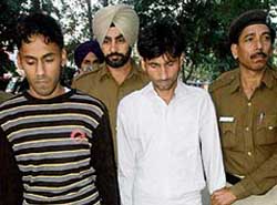 Accused Sanga (left) and Mohammad Kasif being taken to Sector 45 police post on Friday.