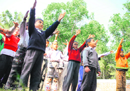 Special children exercise on the premises of the Prerna Institute run by Sehyog India at RS Pura.