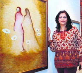 Kajal Nalwa with one of her paintings during her exhibition ''A Journey'' at India Habiatat Centre in New Delhi