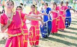 Students of the Army Public School present a folk dance during the annual sports day 