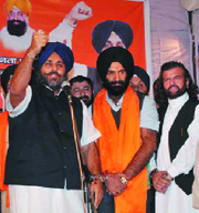 Shiromani Akali Dal president Sukhbir Singh Badal campaigns for party candidate Maninder Sirsa (C) from the Jangpura constituency in New Delhi on Friday night.
