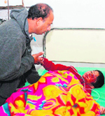 Rohit, who sustained injuries in a road accident, undergoes treatment at a hospital in Karnal on Saturday.