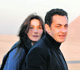 French President Nicolas Sarkozy and his model-turned- singer wife 