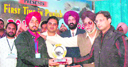 Patiala deputy commissioner Vikas Garg honours the winner of the Auto-Cross Motor Rally in Patiala on Sunday.