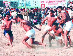 Players in action during a kabaddi match at Parsrampur village near Jalandhar on Sunday.