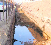 Sewage water has started accumulating in trenches dug by a company constructing a bridge at Raikot. 
