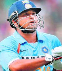 Sachin Tendulkar walks back to pavilion after being bowled by Stuart Broad
