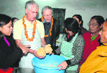 Robert Giacometti kneads dough at a bakery class for Garhwali women.