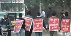 Members of Surbhi Pariwar campaign in their own way for the forthcoming state assembly elections in New Delhi on Monday. 