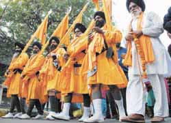 Devotees take out a procession on the occasion of Martyrs Day of Guru Teg Bahadur in New Delhi on Monday. 