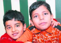 Ten-year-old Janu Khurana (right) with his younger brother, Sanyam