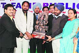 Ashok Kumar Baath distributes prizes on the annual function of Saint Farid Public School, Mandi Gobindgarh, on Monday.
