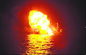 In this Indian Navy handout picture received on Monday, an alleged pirate vessel burns after being hit during anti-piracy operations at sea in the Gulf of Aden on November 18.