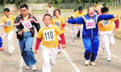 Special children take part in a race during an athletics meet in Chandigarh on Tuesday.