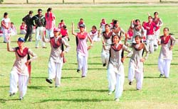 Schoolchildren take part in a rehearsal for the inauguration of the National School Games in Patiala on Tuesday. 