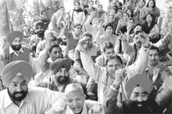 LIC employees stage protest, demanding a revision in their wages, in Chandigarh on Tuesday. 
