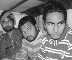Two of the accused, Ravinder Singh Changha and Mangal Singh, who were arrested after they allegedly fired at a Mohali police party