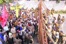 Employees from local bodies stage a demonstration at the Vidhan Sabha in Dehradun on Tuesday. 
