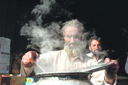 A vendor prepares Kaahwa, Kashmiri tea, in Jammu on Tuesday. 