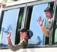 Indian fishermen wave from a bus that they and others boarded after they were released from a jail in Karachi on Tuesday. Pakistan released 99 Indian prisoners from a jail in Karachi on Tuesday. Most of the Indians are fishermen arrested for violating Pakistan's territorial waters. 