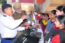 Instructors give tips to girls on traffic rules during a function organised by the traffic police at GCG, Sector 42, Chandigarh, on Wednesday.