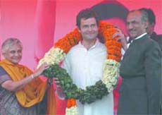 AICC general secretary Rahul Gandhi being greeted by Sheila Dikshit and DPCC president J.P. Aggarwal during a rally in New Delhi on Wednesday. 