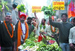 BJP supporters protest against price rise of vegetables at Chandni Chowk in New Delhi on Wednesday. 