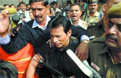 Underworld don Abu Salem after being produced at the Tis Hazari courts for allegedly making an extortion call to a city businessman in New Delhi on Wednesday. 