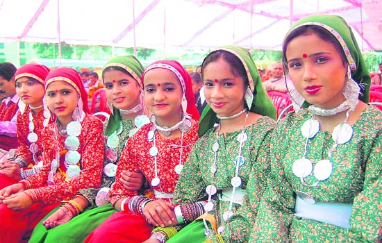 Girls students participate in traditional dress competition at the Uttarakhand Mahotsav in Dehradun on Wednesday.
