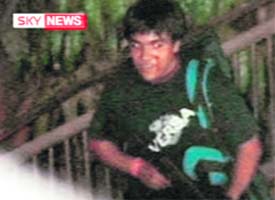 A TV grab via Sky News shows an armed man suspected to be one of the assailants, according to Sky News.