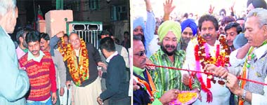 Chaman Lal Gupta, BJP candidate from Jammu West constituency, (right) Raman Bhalla, Congress candidate from Gandhi Nagar constituency, with their supporters during the election campaigning in Jammu