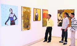 Visitors at the exhibition put up by artist group Corners from Mumbai at Artmosphere Art Gallery in Ludhiana
