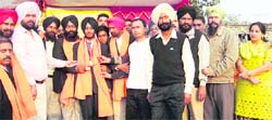 Gurbir Singh receives medal at Dehlon, near Ahmedgarh