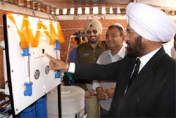 District and Sessions judge Kuldip Singh presses the button to inaugurate the RO system in Central Jail, Bathinda, on Thursday. 