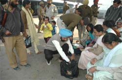 Security personnel checking the luggage of passengers at the Bathinda railway station on Thursday.