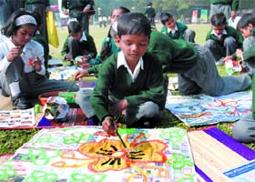 Children participate in a painting competition during the Nehru Bal Mela 'Dhanak Din: Living Together in Harmony' at Nehru Memorial in New Delhi