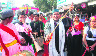 A mens cultural troupe presents a folk dance.