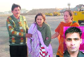 Neetika, widow of Flight Captain Sachin Bhatia (inset), is consoled by relatives at the IAF station, Sirsa