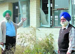 Capt Baldev Singh (retd) and sarpanch Bhajan Singh show the dismal condition of the Sainik Bhavan at Padhiana village near Jalandhar.