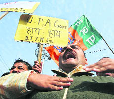 BJP activists condemn the Central government over Mumbai blasts, in Jammu on Thursday.