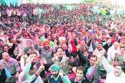 Workers and owners of dyeing industries stage a dharna outside the PPCB office in Ludhiana on Thursday