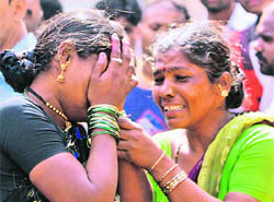 Sharda (left) being consoled by her relative outside St George Hospital after she lost her children in a militant attack in Mumbai on Thursday. 